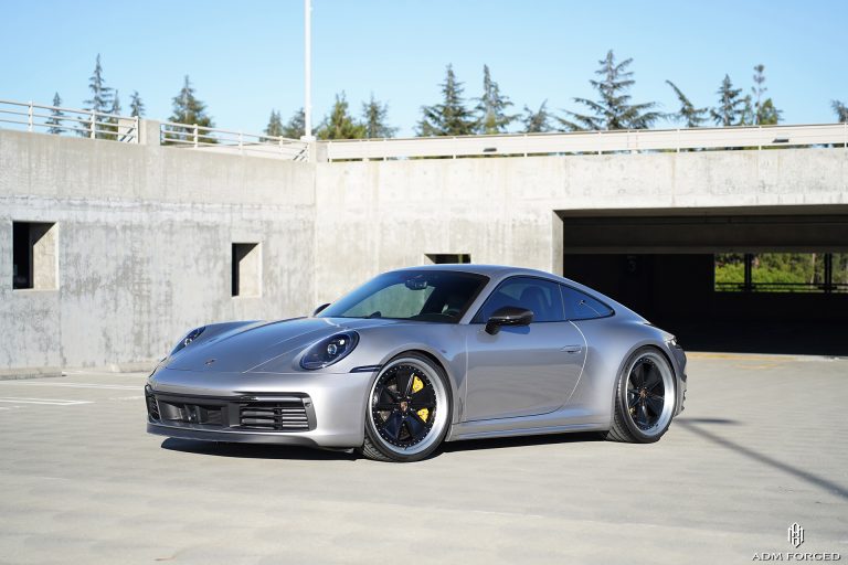 Porsche 911 Carrera 992.2 on the ADM Forged Retro Series RT303 in the Matte Black center with Matte Brushed Lip with center cap cut for OE Porsche application.